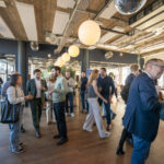 Holland Fintech Association networking event with fintech professionals and industry leaders discussing digital finance innovation in Amsterdam